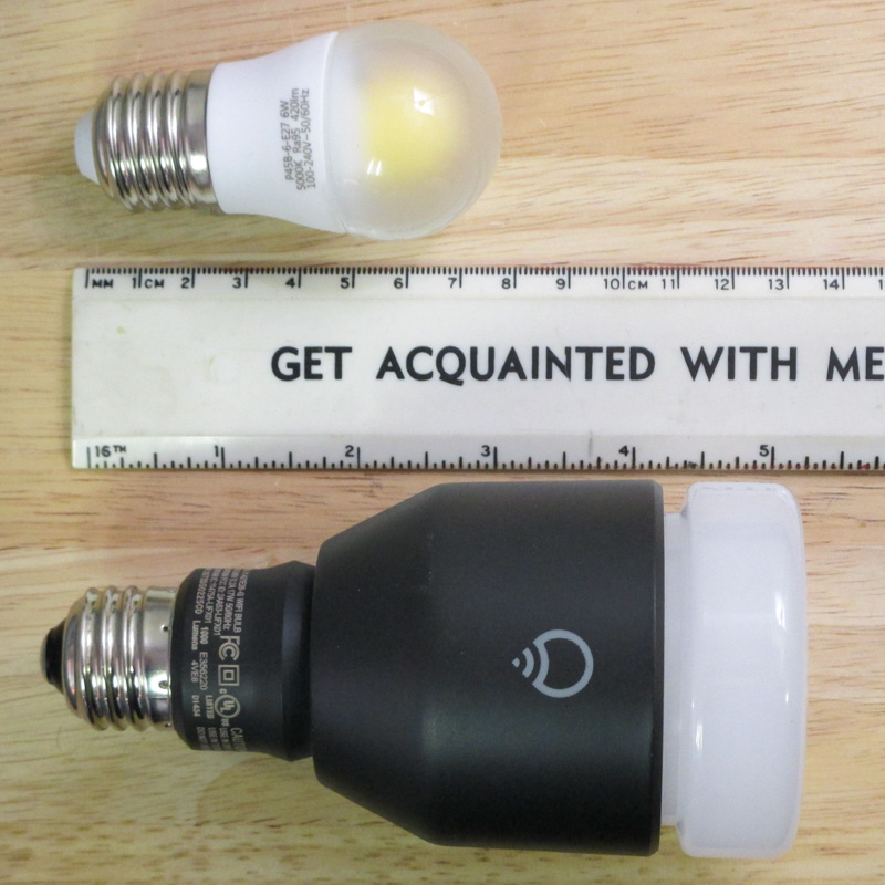 Yuji bulb measuring about 3 inches and LIFX bulb measuring about 5 inches