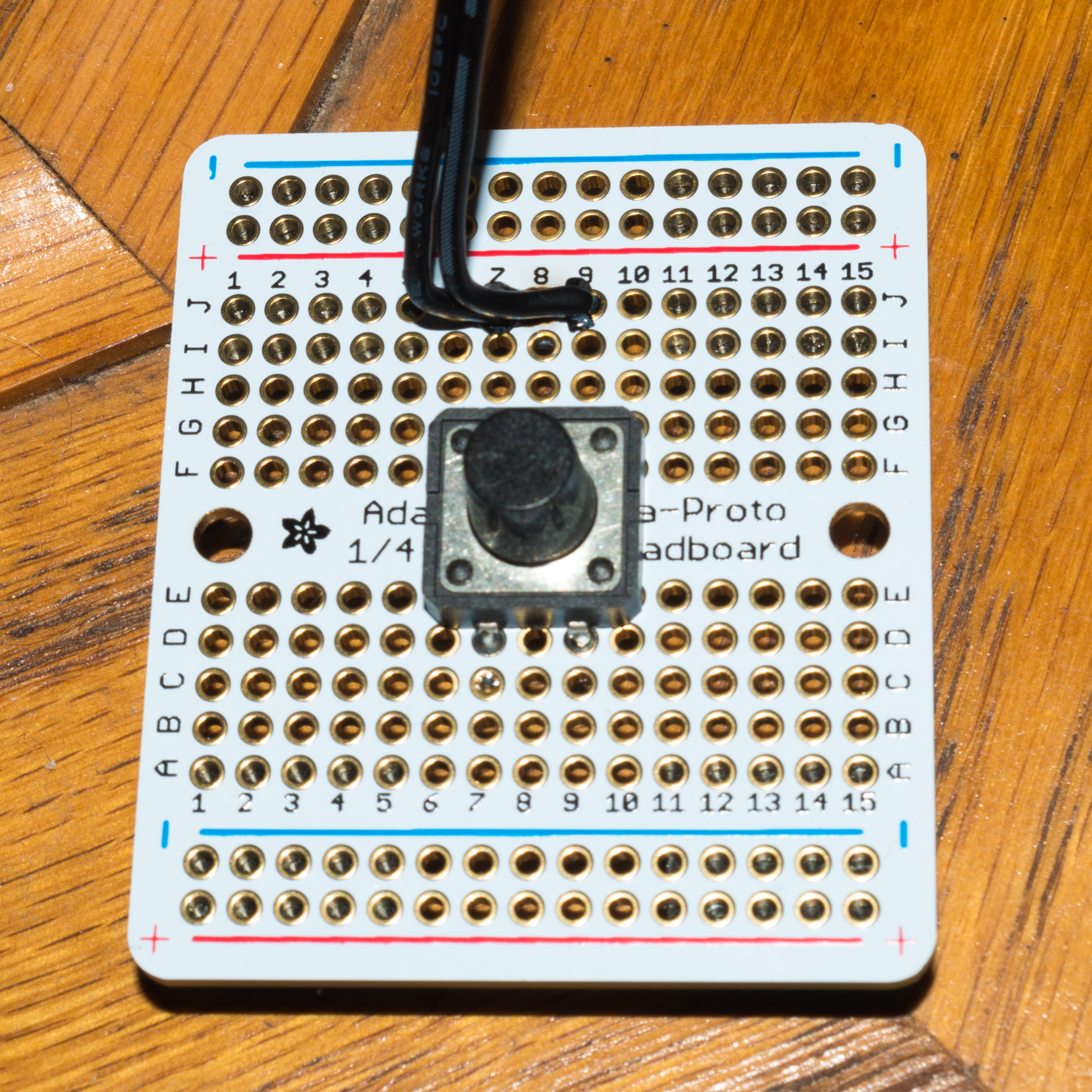 Pushbutton soldered to a Perma-Proto board