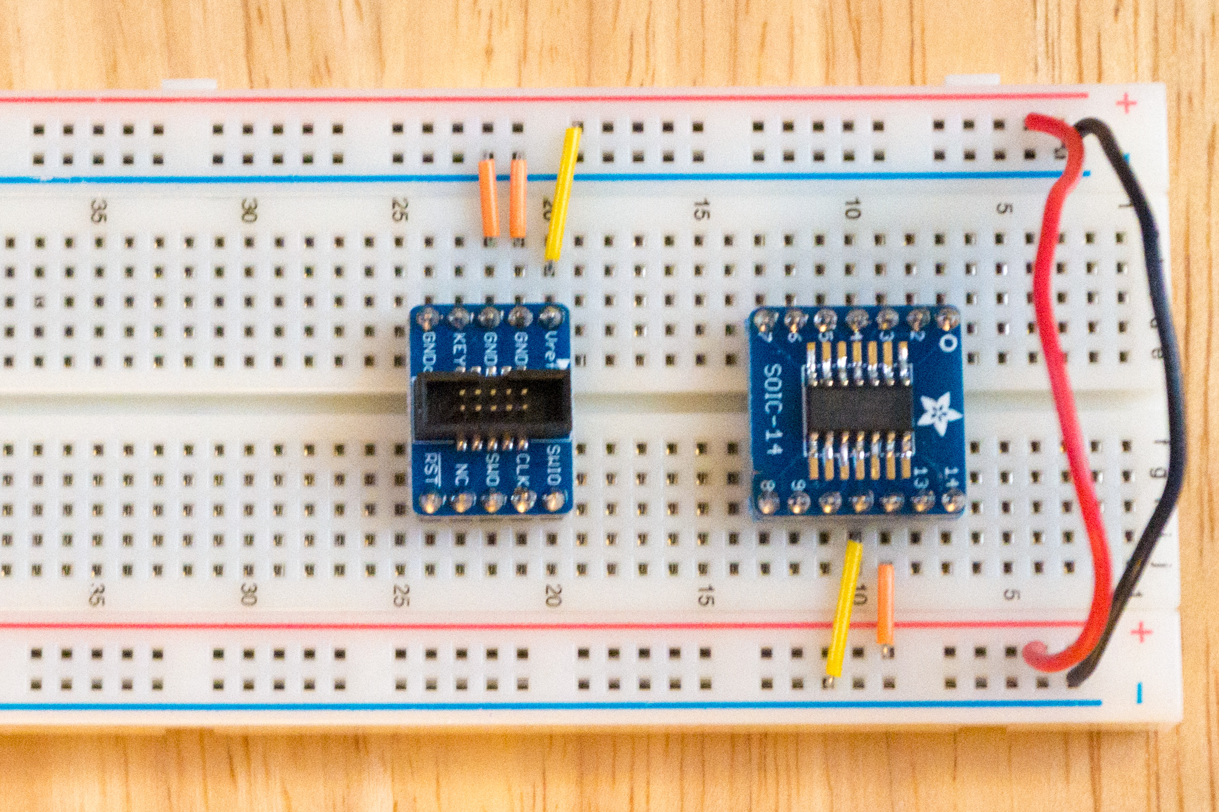 Breadboard with power and ground wires connected.